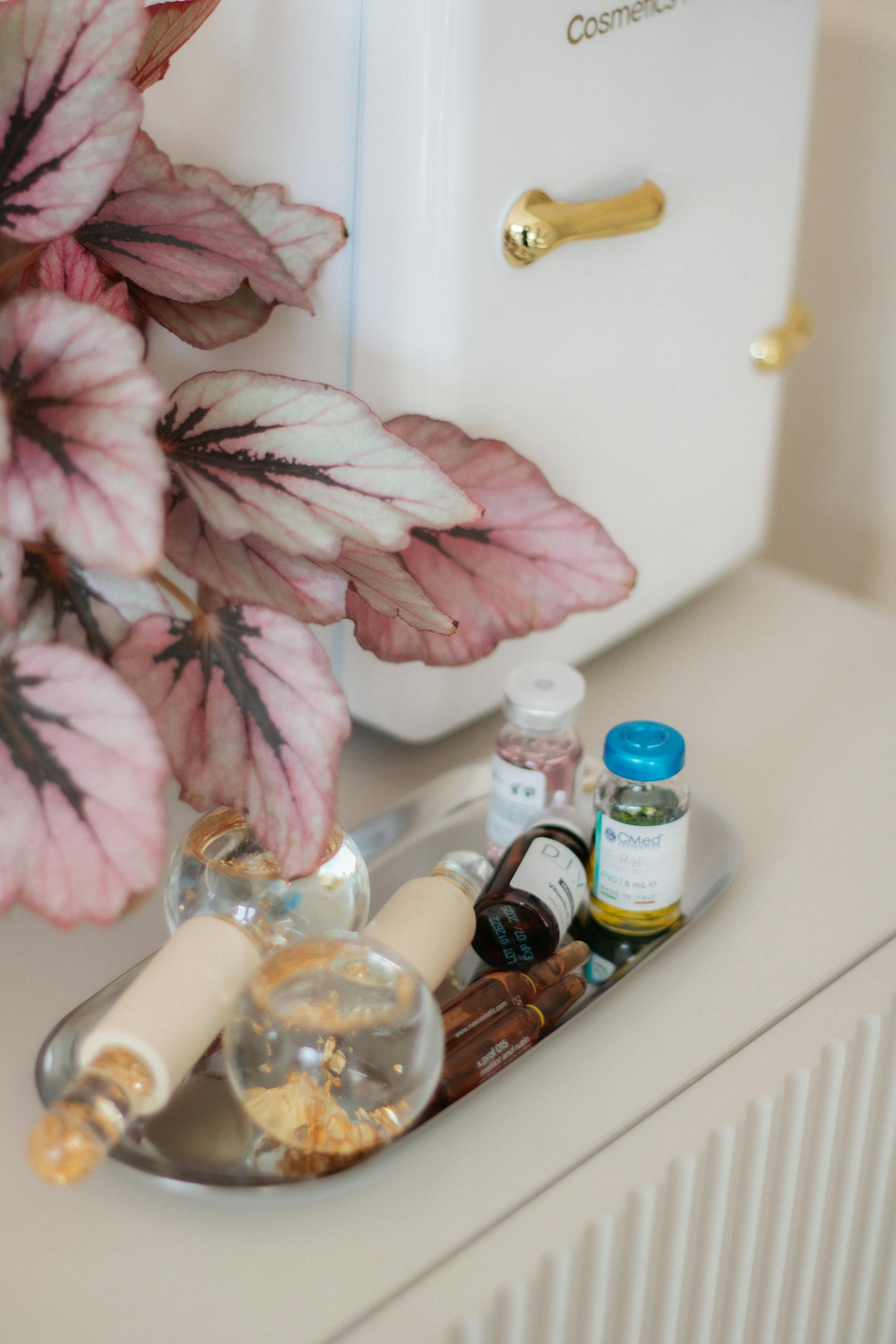 A stylish vanity setup with cosmetics, beauty tools, and decorative elements for an elegant look.