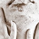 Artistic close-up of a woman's textured skin emphasizing raw beauty and skincare challenges.