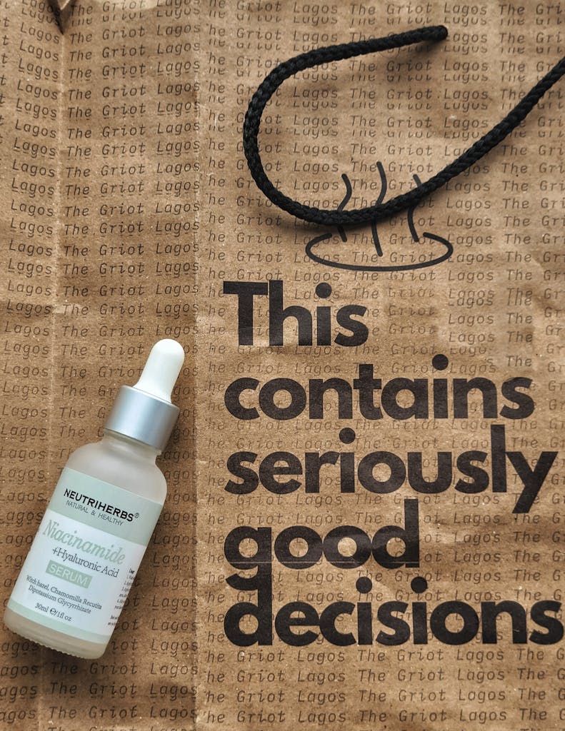 Neutriherbs Niacinamide Serum paired with The Griot branded bag for skincare enthusiasts.