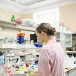 A female scientist conducting research in a well-equipped laboratory.