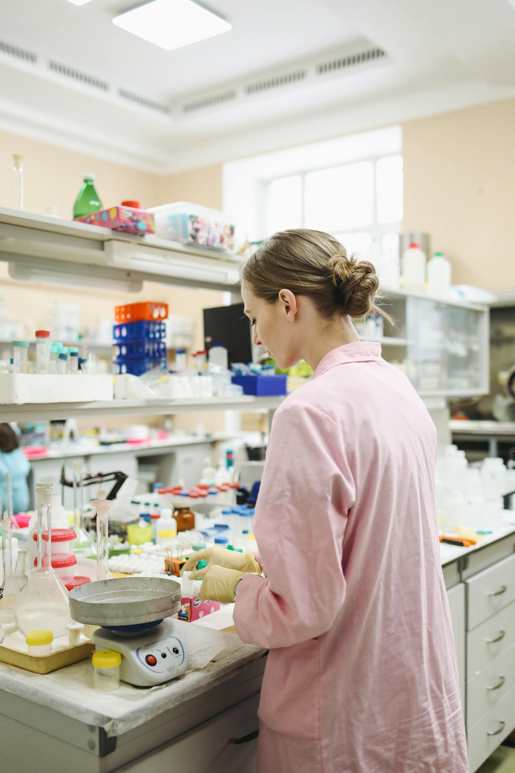 A female scientist conducting research in a well-equipped laboratory.